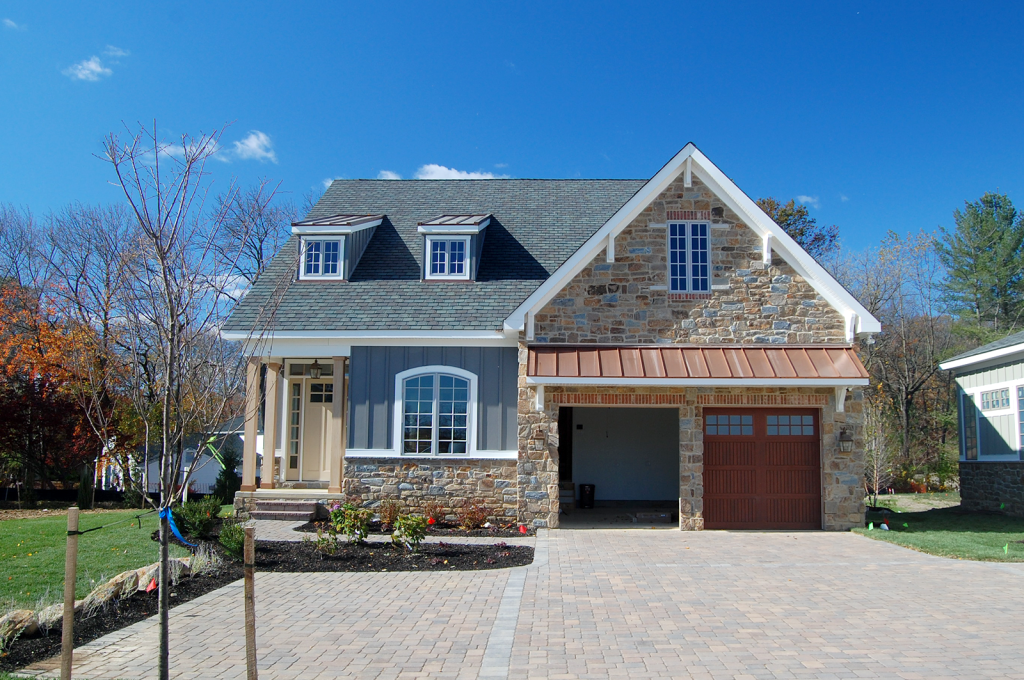 Gray stone house with garage
