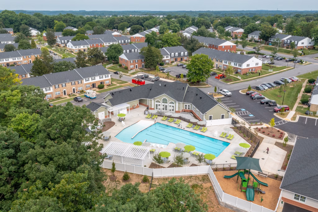 Aerial view of Chadwick Manor Clubhouse exterior with a swimming pool and playground by Wade Architecture.