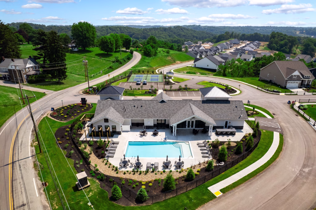 Modern commercial clubhouse aerial design with a swimming pool and patio by Wade Architecture.